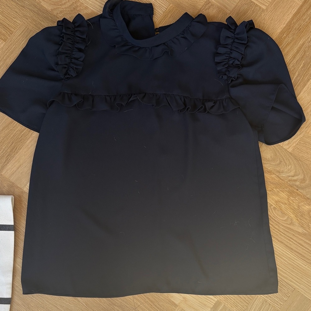 Laura Garcia Navy top with ruffles